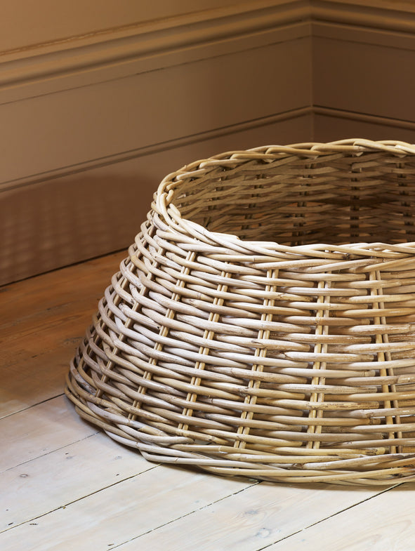 The Rattan Christmas Tree Skirt beautifully covers the bottom of your Christmas Tree.
